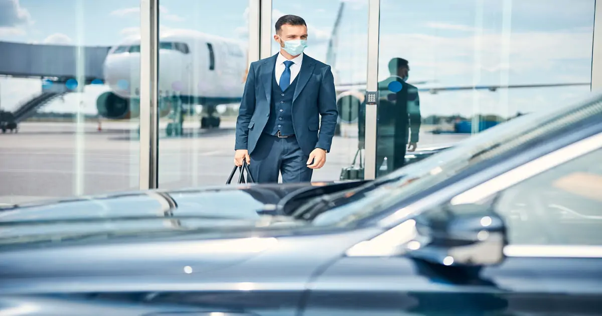 a client waiting for his chauffeur at the airport